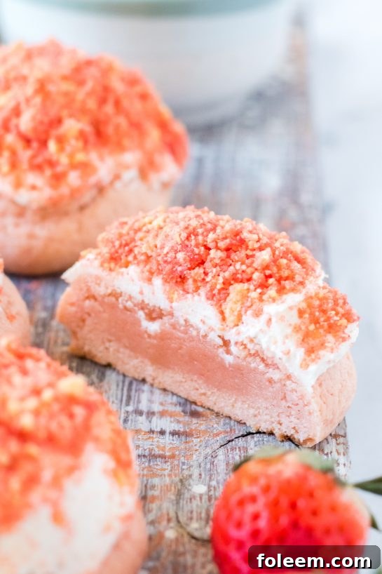 Cut-open Strawberry Crunch Cookie showing its soft interior, a delightful treat for any celebration.