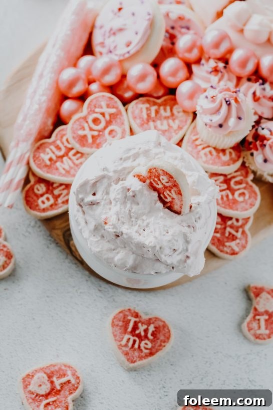Easy Strawberry Cake Mix Dip displayed with a variety of cookies and fruit, ideal for a baby shower or any festive occasion