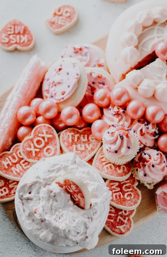 Easy Strawberry Cake Mix Dip displayed with festive treats and dippers, perfect for a baby shower or a holiday