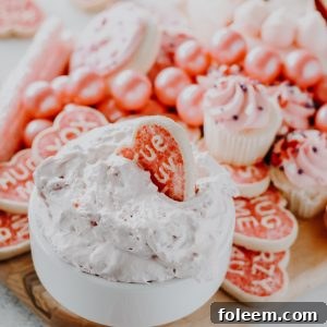 A close-up image of the finished Strawberry Cake Mix Dip, garnished with fresh strawberries