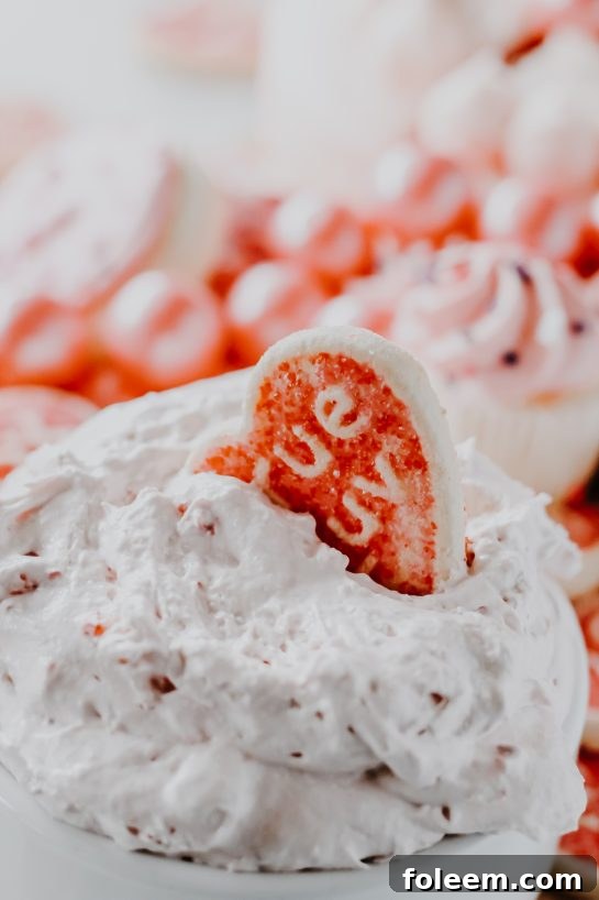 Close-up view of the smooth and creamy texture of Strawberry Cake Mix Dip, showcasing its delightful pink color