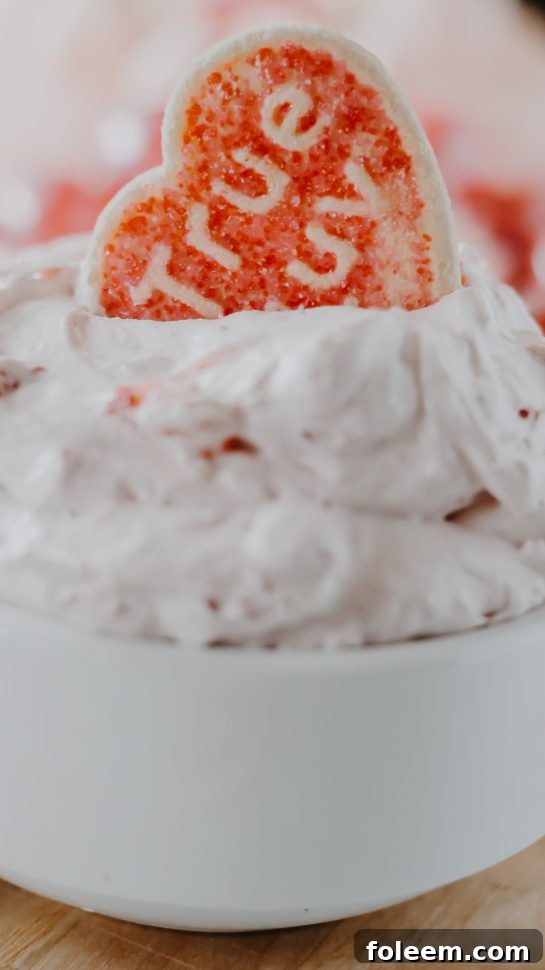 A festive spread of Strawberry Cake Mix Dip and a variety of pink-themed dippers, perfect for Valentine's Day celebrations