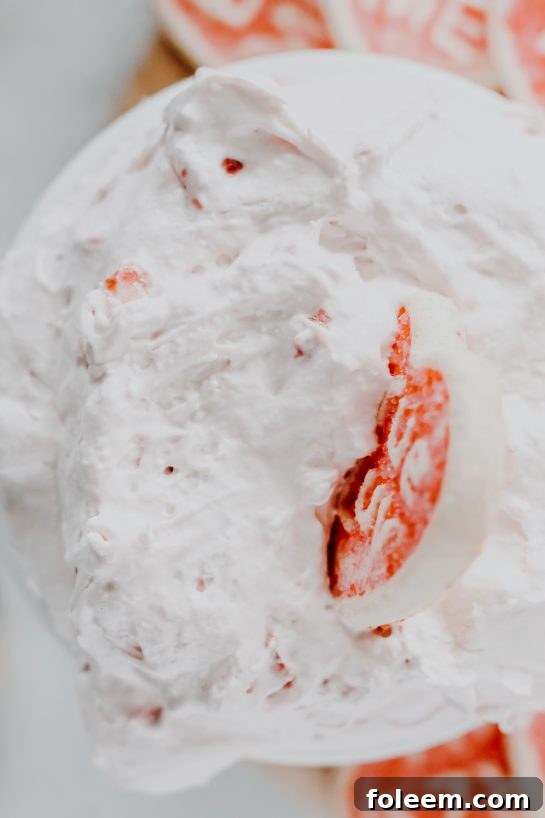 Close-up of the delicious Strawberry Cake Mix Dip, highlighting its rich pink color and inviting texture