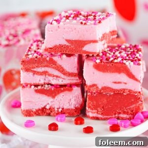 Layered Valentine's Day Strawberry Fudge recipe requires just four ingredients and can be made in under 10 minutes! Pretty and super cute gift for your Valentine.