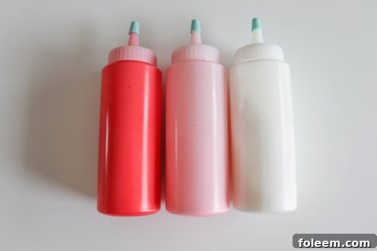 Photo of the icing bottles of the easy sugar cookie royal icing recipe for the sugar cookies for any holiday or party
