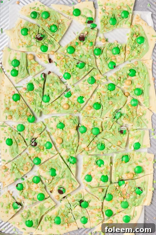 Simple Leprechaun Bark candy recipe with green and colorful toppings, delicious and ideal for a St. Patrick's Day party.