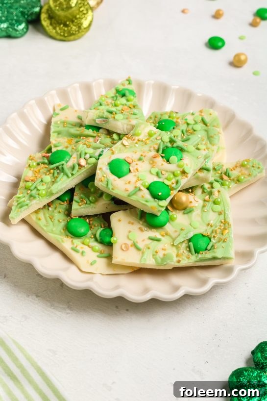Leprechaun Bark, a delightful candy recipe bursting with festive green and colorful toppings, perfect for Saint Patrick's Day celebrations.