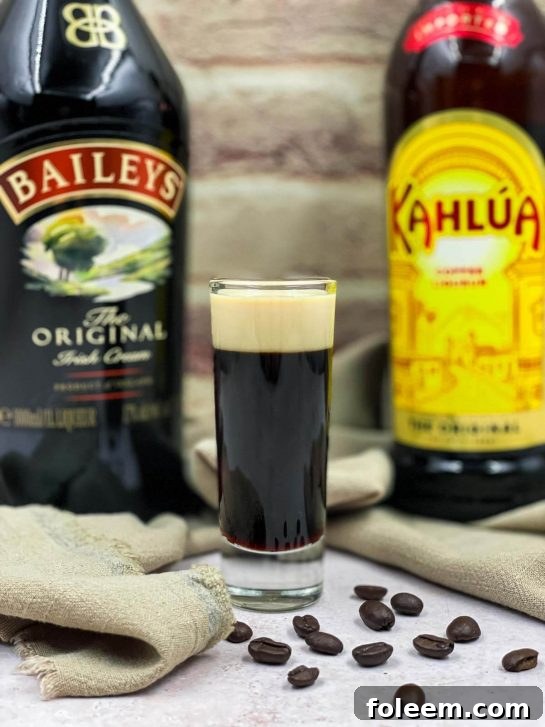 Baby Guinness beer shot recipe, a layered shot resembling a miniature Guinness pint.