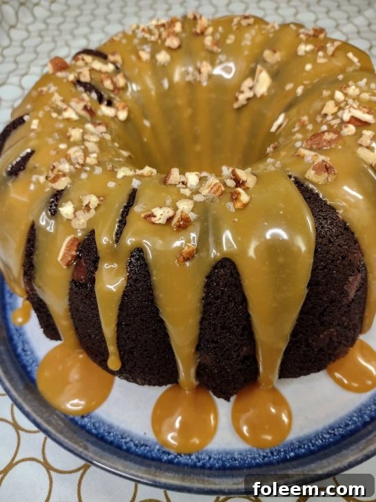 Guinness Turtle Cake Recipe, a rich chocolate cake with caramel, pecans, and a Guinness infusion.