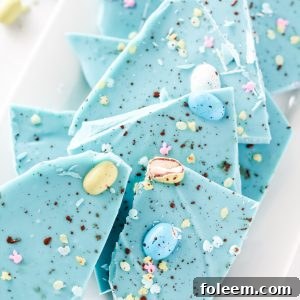 No-Bake Robin Egg Easter Bark show stopping beautiful blue Easter Bark (with HOW TO VIDEO!). Super simple and easy to make, topped with chocolate candy eggs is the cutest dessert for Easter!