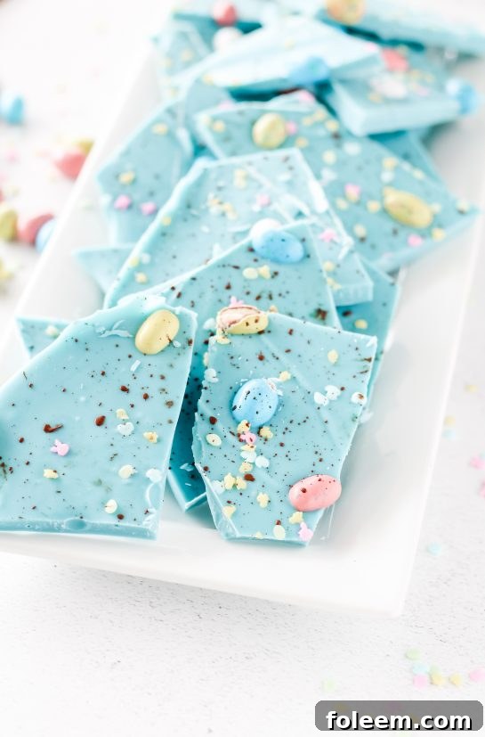 No-Bake Robin Egg Easter Bark show stopping beautiful blue Easter Bark. Super simple and easy to make, topped with chocolate candy eggs is the cutest dessert for Easter Sunday!