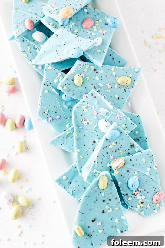 No-Bake Robin Egg Easter Bark show stopping beautiful blue Easter Bark. Super simple and easy to make, topped with chocolate candy eggs is the cutest dessert for Easter!