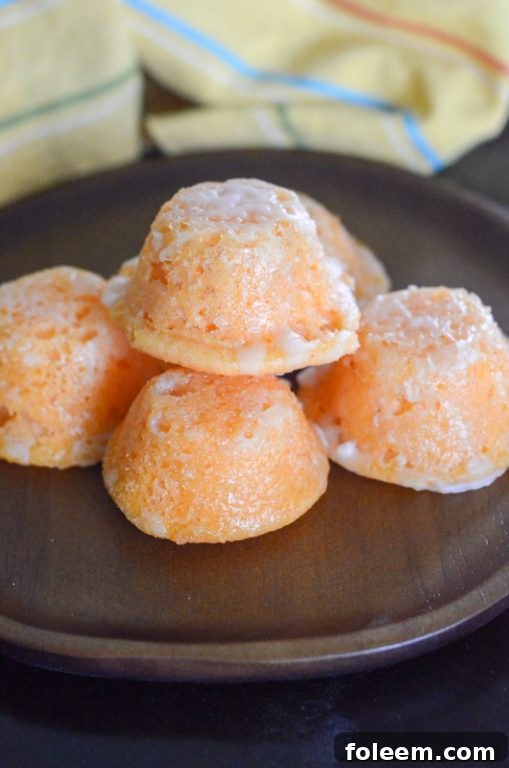 Between the orange cake batter and the powdered sugar glaze, this orange cake bites recipe is pretty sweet and righteous! And because this cake is based off of a store-bought orange cake mix, this bite-size dessert recipe is easy to boot!