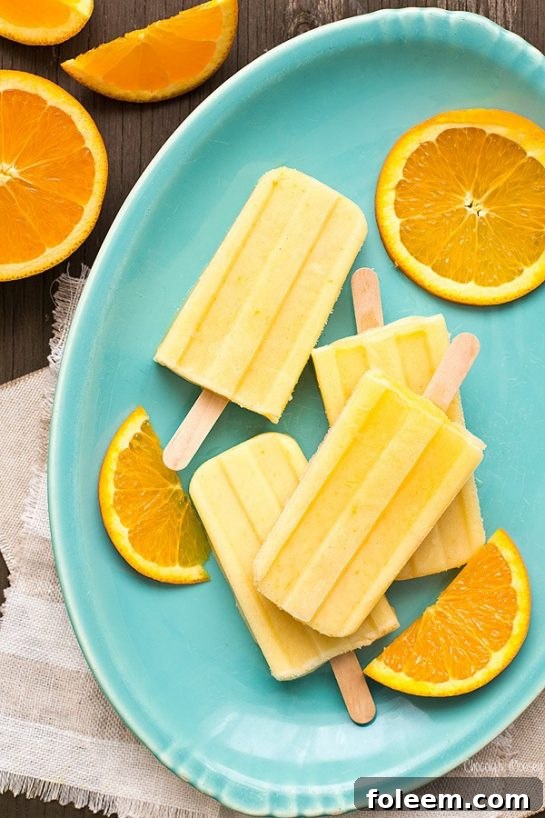 Refreshing Orange Creamsicle Yogurt Pops made with only 4 ingredients, perfect for a healthy summer treat.