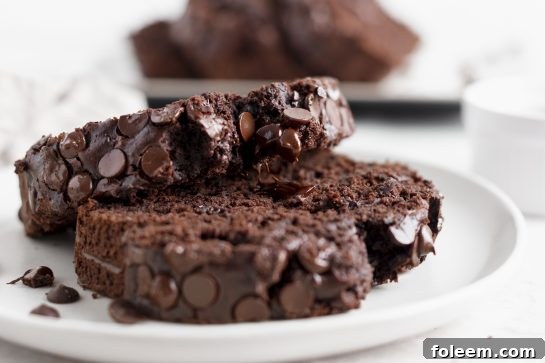 Two beautiful loaves of homemade Chocolate Zucchini Bread, perfectly baked and cooling, ready to be enjoyed as a wholesome and delicious treat.