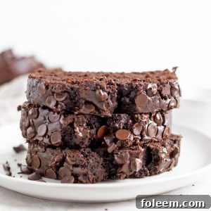 Moist and fudgy Chocolate Zucchini Bread recipe is filled with shredded zucchini and no one will be any the wiser since it tastes just like chocolate cake. It’s super delicious and secretly healthy.