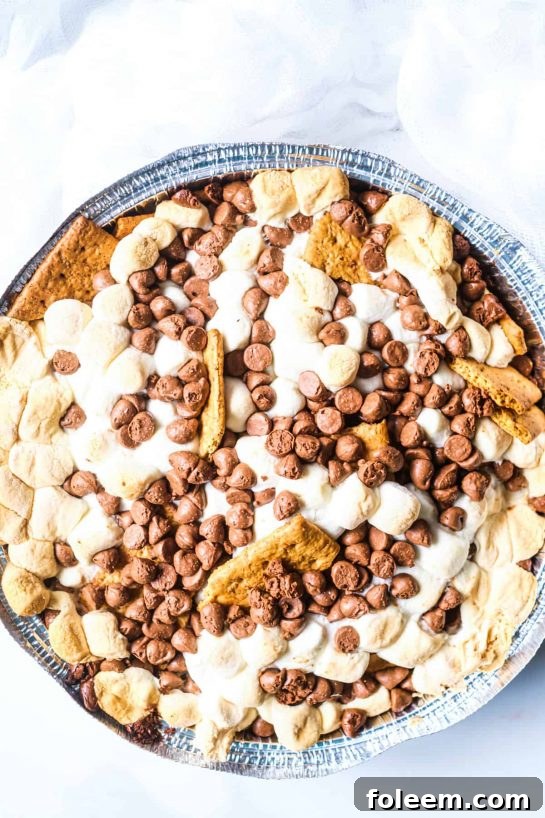 Toasty marshmallow, sweet, melty chocolate, and crunchy graham crackers – S’mores are the flavor of summer. Enjoy them anytime with this fun S’mores Nachos recipe, perfect for the grill or oven.