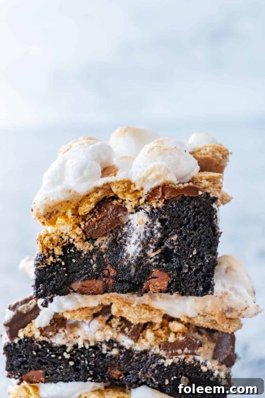 Easy S’more Brownies Recipe combines chocolatey brownies, gooey marshmallow, delicious graham cracker, and tasty chocolate for a perfect treat.