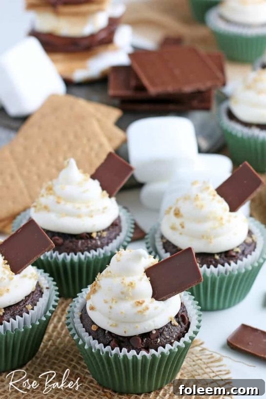 These S'mores Cupcakes are a perfect dessert! Rich chocolate cupcakes with a graham cracker bottom and topped with the creamiest marshmallow frosting!