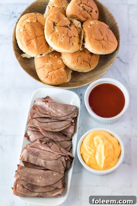 Essential ingredients laid out for making copycat Arby's Beef & Cheddar sandwiches at home.