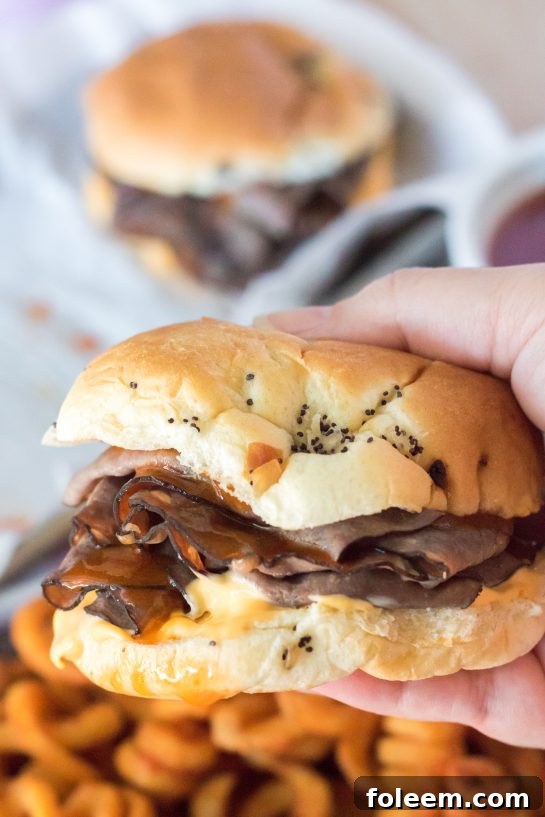 Finished copycat Arby's Beef & Cheddar sandwich, emphasizing the rich sauces and perfectly toasted bun.