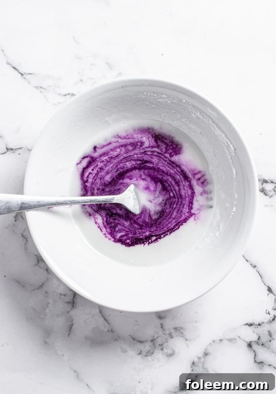 Delicious and vibrant homemade blueberry glaze recipe, specially made for the Blueberry Chocolate Chip Cookies, adding a beautiful finish.
