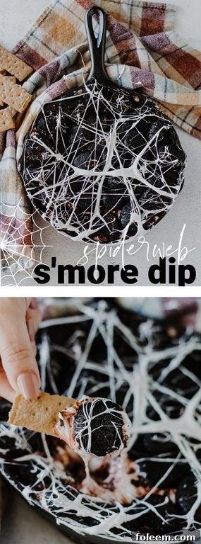 Scary Spiderweb S'mores Dip, a mouth-watering Halloween party food with creamy white chocolate, toasted marshmallows, and a delicate web effect, served with various dippers