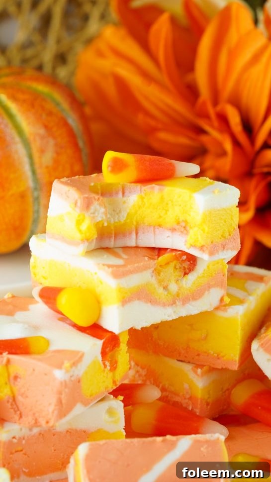 Close-up of the No-Bake Candy Corn Fudge recipe that is a delicious and fun Halloween or fall treat for kids and adults. This creamy homemade fudge only needs 4 ingredients and 15 minutes to make!