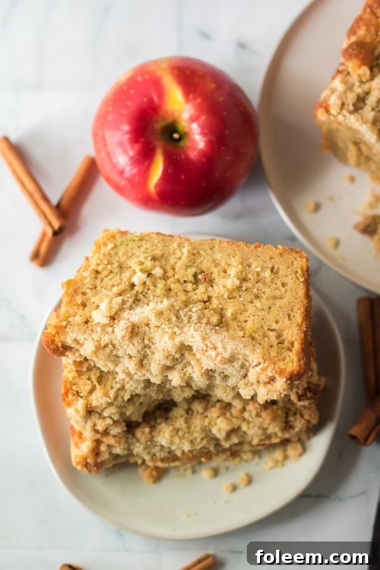 This easy Apple Streusel Coffee Cake fall dessert recipe just perfect for Fall! This soft, moist cake is easy to make because it starts with a box mix that you jazz up with apples and a crunchy cinnamon streusel topping. 