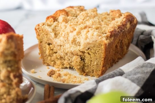 Simple Apple Streusel Coffee Cake fall dessert recipe just perfect for Fall! This soft, moist cake is easy to make because it starts with a box mix that you jazz up with apples and a crunchy cinnamon streusel topping. 