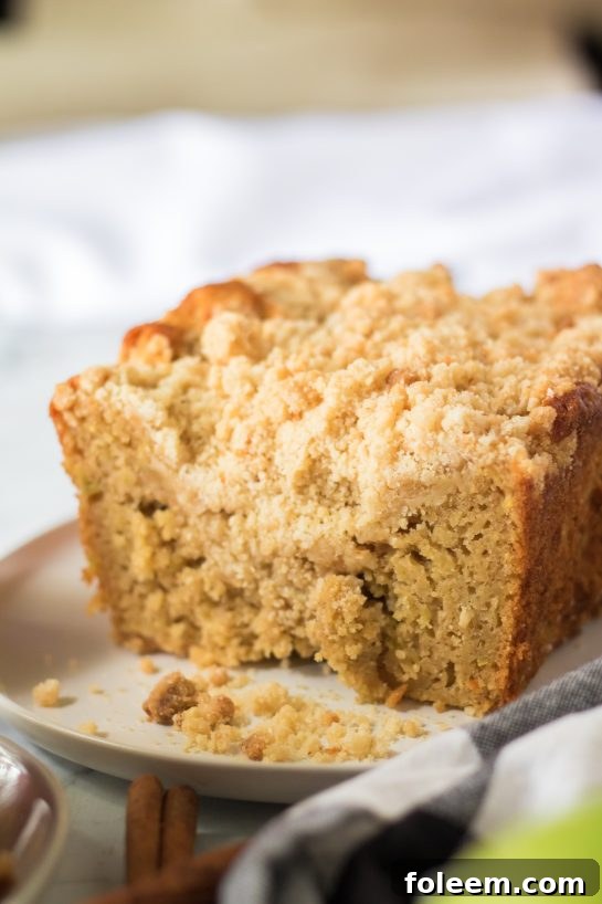 Delicious Apple Streusel Coffee Cake fall dessert recipe just perfect for Fall! This soft, moist cake is easy to make because it starts with a box mix that you jazz up with apples and a crunchy cinnamon streusel topping. 