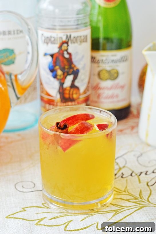 Crowd-Pleasing Pumpkin Sangria bursting with sweet and spiced fall flavors, perfect for autumn gatherings, Halloween parties, or Thanksgiving feasts