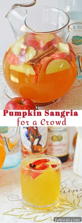 Full pitcher of Pumpkin Sangria with sliced apples and cinnamon sticks, ready for a fall gathering