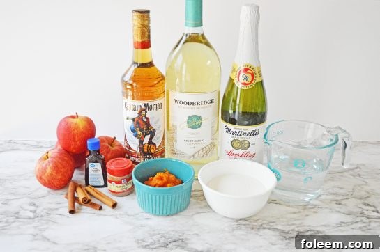 Ingredients laid out on a table to make a homemade pumpkin sangria recipe