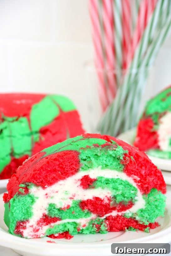 A festive array of Christmas Cake Roll slices arranged artfully on a serving platter, perfect for sharing during the holidays.