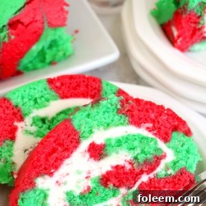 Beautifully decorated Christmas Cake Roll, a festive holiday dessert perfect for sharing with loved ones.