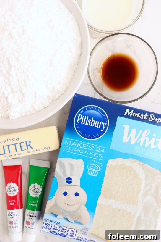 A close-up of the ingredients laid out for making the Christmas Cake Roll, including cake mix, butter, vanilla, powdered sugar, milk, and red and green gel food coloring.