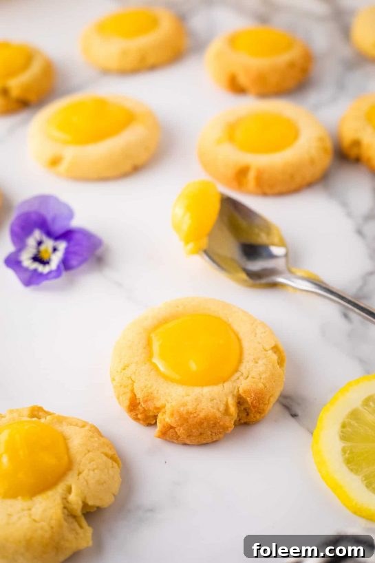 Lemon Curd Thumbprints recipe. If you love lemon flavor then make a batch of these thumbprints asap! They are so colorful and tasty!