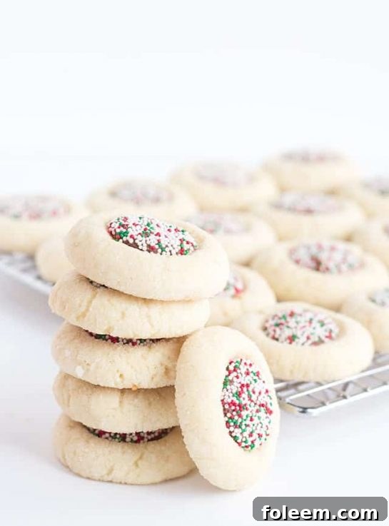 Candy Thumbprints recipe. This pretty thumbprint recipe is perfect for anyone who loves candy and cookies. Bring them together for the ultimate sweet treat.