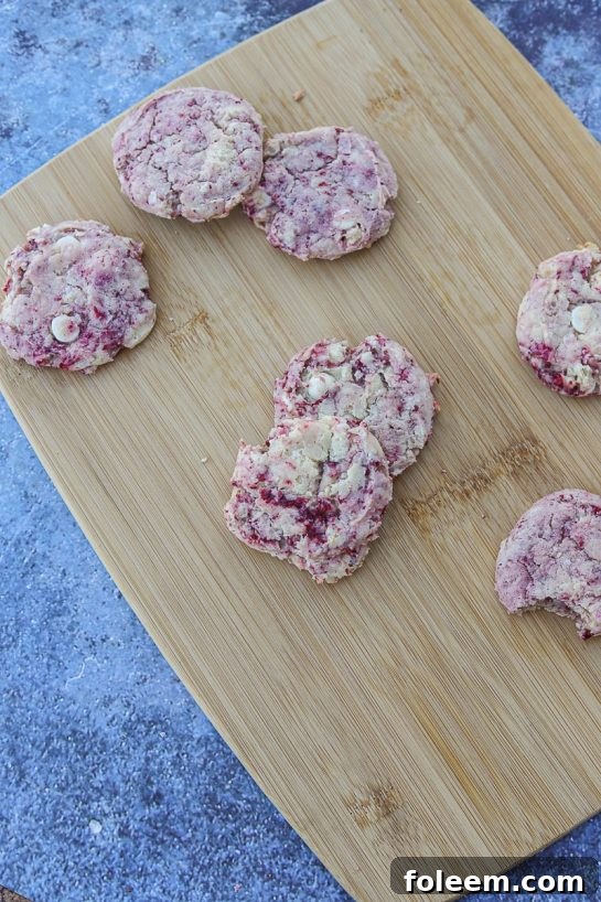 Beautiful White Chocolate Chip Thimbleberry Cookies, a unique pudding-enhanced recipe with sweet white chocolate and tart thimbleberries.