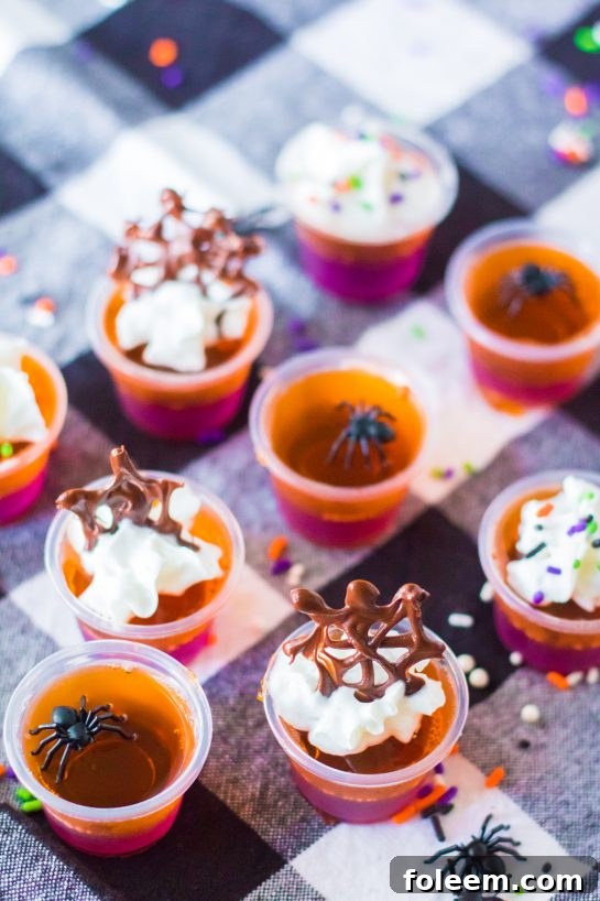 Boozy Halloween Jello Shots are a colorful and fun party idea, sure to be a favorite cocktail among guests.