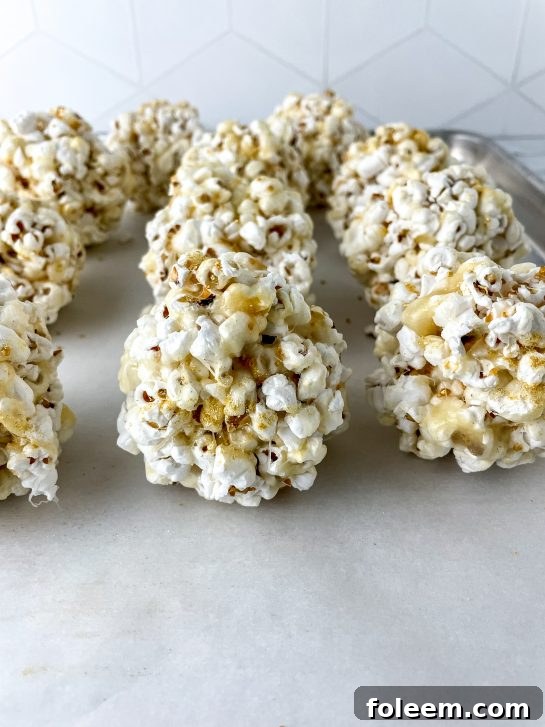 New Year Champagne Popcorn Balls are so sticky, tasty, and everyone will love them. They’re the perfect snack recipe for any party, holiday or get together, but especially New Year's Eve or New Year's Day dish to pass!