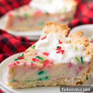 This Christmas Sugar Cream Pie recipe is my favorite for the holidays. This is a delicious creamy pie decorated with holiday sprinkles for a festive look. The filling is silky and rich - perfect for any occasion. The crust is a no-roll pie crust which makes it fabulous to throw together for the busy holiday season. 