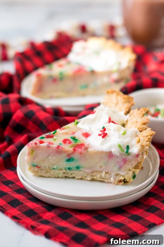 This Christmas Sugar Cream Pie recipe is my favorite for the holidays. This is a delicious creamy pie decorated with holiday jimmies sprinkles for a festive look. The filling is silky and rich - perfect for any occasion. The crust is a no-roll pie crust which makes it fabulous to throw together for the busy holiday season. 