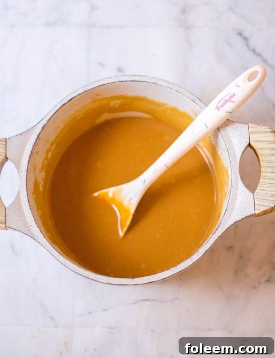 Melting the caramel for the Valentine's Day Millionaire Bars recipe