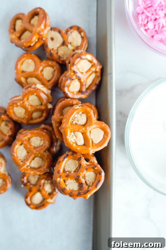 The assembled Valentine's Day Pretzel Bites ready to be dipped in smooth white chocolate