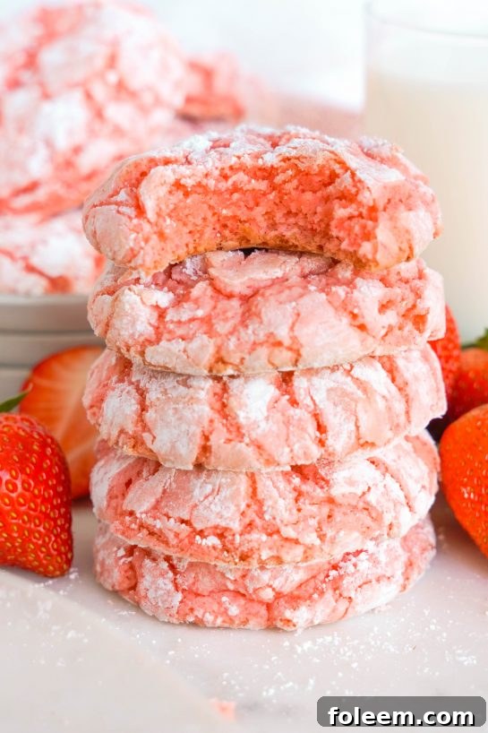 Strawberry Crinkle Cookies: a simple and delicious strawberry cookie recipe for Valentine's Day made with cake mix. If you're looking for the easiest cookie recipe on the planet, you found it! These cookies require just FIVE ingredients and come out perfectly every time.