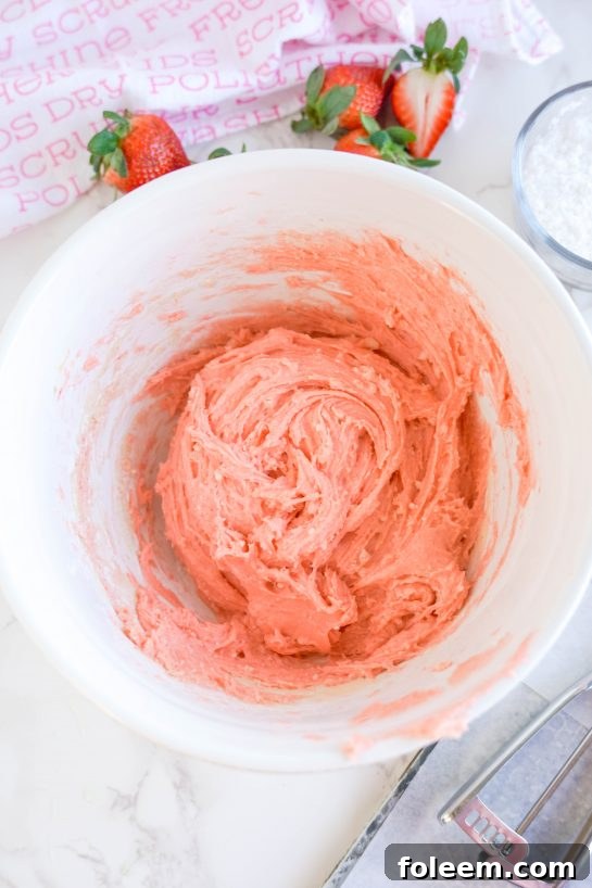 Batter mixed to make these Strawberry Crinkle Cookies recipe for Valentine's Day.