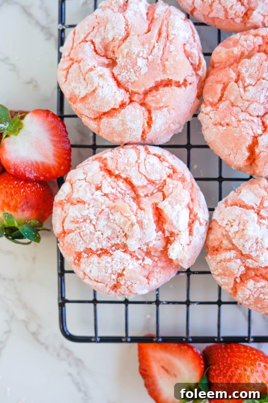 Strawberry Crinkle Cookies: an easy and delicious strawberry cookie recipe for Valentine's Day made with cake mix. If you're looking for the easiest cookie recipe on the planet, you found it! These cookies require just FIVE ingredients and come out perfectly every time.