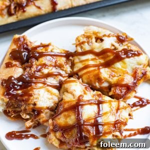 Sheet Pan BBQ Chicken Pizza with a crispy crust, melted cheese, and tender BBQ chicken, garnished for serving.